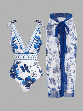 SHEIN Swim Oasis Conjunto de maiô de uma peça e saia de cobertura com estampa floral, nó de ombro e ideal para as férias de verão das mulheres na praia